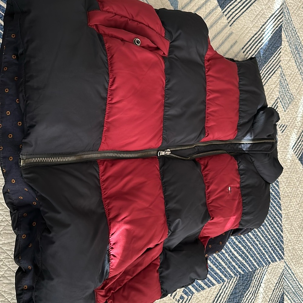 Used Tommy Hilfiger puffer vest in medium size.